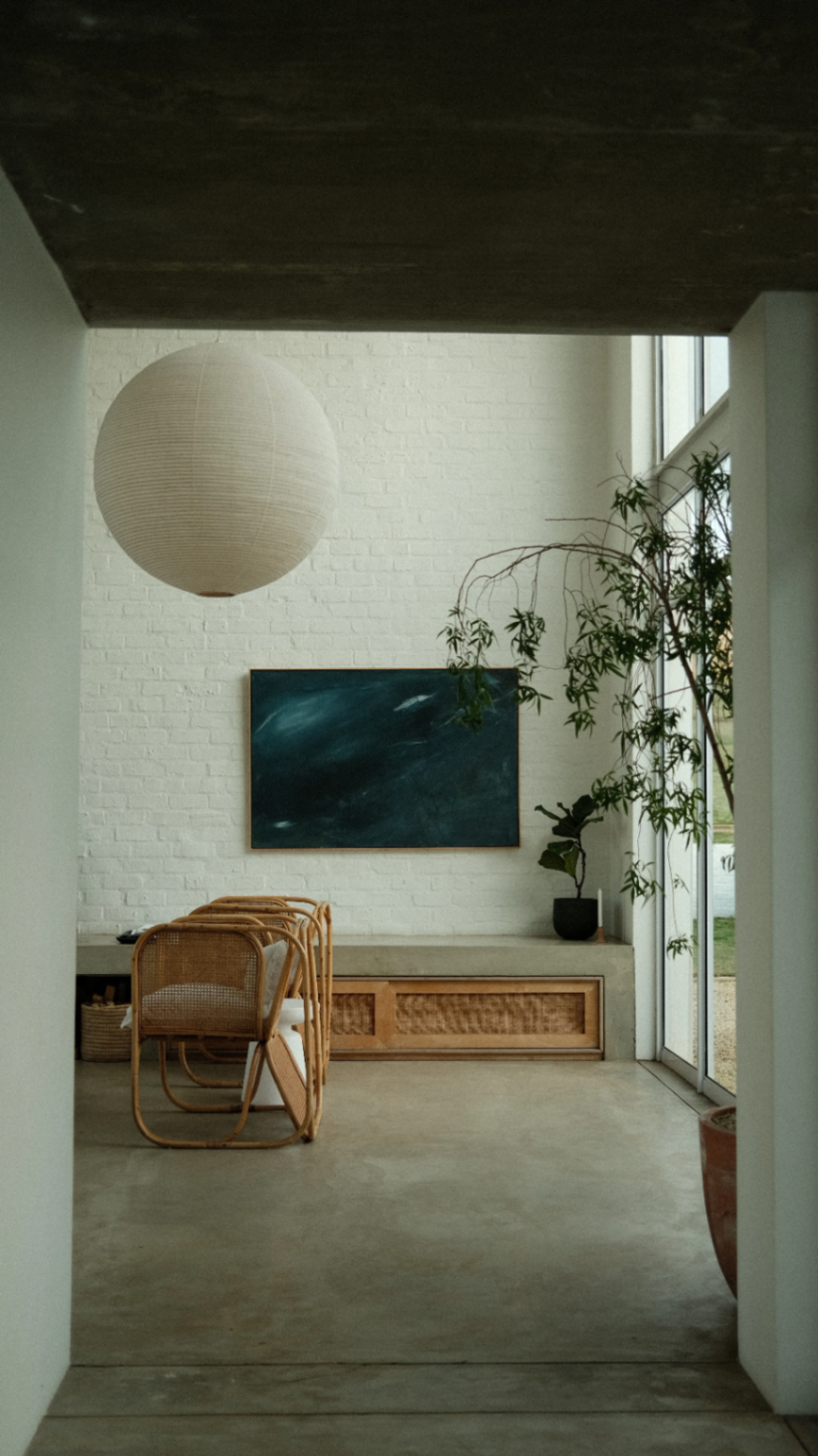 Entry bench with paper lantern and blue canvas