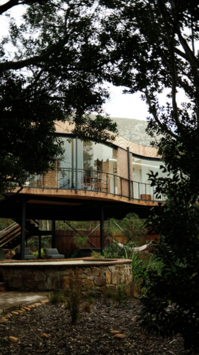 Exterior elevation over the stone basin and garden